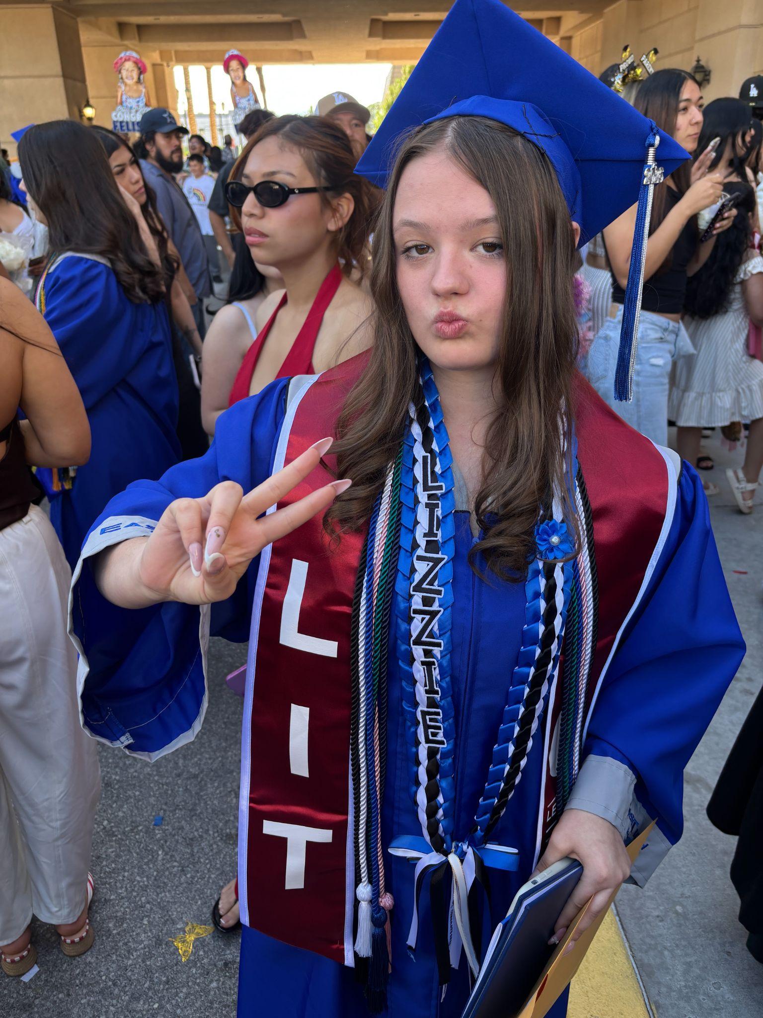 LIT student in a graduation cap and gown wearing an LIT stole